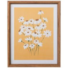 a painting with white daisies in a wooden frame on an orange background is shown