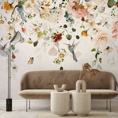 a living room with flowers painted on the wall