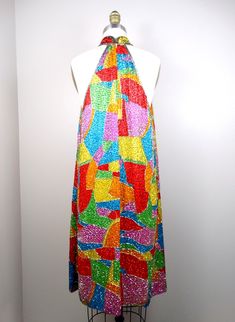 "This vintage dress is completely and heavily embellished with colorful glass beading! Amazing! It's in perfect condition!! Measurements: Bust - 38/40\" Waist - 42/44\" Hips - 46/48\" Dress Length - 38\" Tag Size - 10 This dress comes from a pet-free and smoke-free home. If you would like more info or have any questions, please don't hesitate to ask!" Embellished Multicolor Sequin Dress For Summer, Embellished Multicolor Sequin Summer Dress, Multicolor Embellished Sequin Dress For Summer, Multicolor Embellished Sequin Summer Dress, Evening Multicolor Beaded Dresses, Beaded Mini Dress, Iridescent Dress, Checkered Jacket, Rainbow Beads