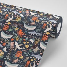 an ocean themed wrapping paper with octopus, sea animals and other marine life on it