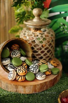 green and white cookies in a wooden container