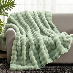 a couch with a blanket on top of it