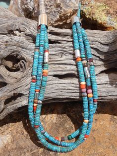 This is a beautiful Handcrafted Native American Made single strand to triple strand heishi necklace. Each necklace is entirely Handcrafted which makes it a ONE OF A KIND you get the exact necklace shown in the pictures. The necklaces that I sell are meticulously crafted by Native American bead workers, and the quality and attention to detail is truly exceptional. The necklace measures about 30" (end to end) bead length is 27" it has a Sterling Silver toggle clasp closer.  The Kingman Turquoise is gorgeous blue and Multi Colored mix of Gemstones the hand stamped Sterling Silver beads add a very rich look to this work of art. I personal own one of these and it is my favorite necklace the colors are stunning and go with almost every outfit. I have gotten so many complainants on this necklace. Southwestern Multi-strand Colorful Beads Jewelry, Southwestern Multi-strand Jewelry With Colorful Beads, Hand-strung Multi-strand Turquoise Necklace Gift, Artisan Turquoise Multi-strand Necklace, Unique Turquoise Multi-strand Jewelry, Unique Multi-strand Turquoise Jewelry, Traditional Turquoise Single Strand Jewelry, Turquoise Multi-strand Gemstone Beads Jewelry, Southwestern Multi-strand Polished Bead Necklaces