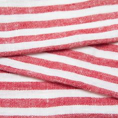 the red and white striped fabric has been folded up to show it's folds