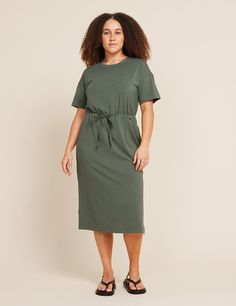 A versatile addition to your capsule wardrobe, this style offers a soft stretch and a comfortable fit with the right amount of stretch. Relaxed, oversized t-shirt dress design with an adjustable drawcord waist and convenient side pockets. Sits comfortably just below the knee for a versatile and essential look. Ready to become your go-to for running errands, weekend occasions, and workdays. Style it casually or dress it up depending on your destination. Casual Drawstring Dresses For Work, Casual Midi Dress With Drawstring For Daywear, Casual Short Sleeve Midi Dress With Tie Waist, Casual Knee-length Midi Dress With Elastic Waistband, Casual Midi Dress With Drawstring, Casual Loungewear Dresses With Tie Waist, Casual Dresses With Relaxed Fit And Drawstring, Casual Relaxed Fit Dresses With Drawstring, Casual Dresses With Drawstring And Relaxed Fit