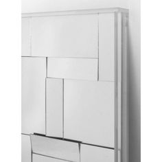 an image of a white cabinet with drawers