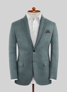 A typical range of noirs and grays in formal wear no longer appeals to you? Try our Caccioppoli Sun Dream Barto Green Wool Silk Suit, which takes traditional suiting in a new, modernized direction. Tailored from a wool blend infused with silk, this suit is adorned in a revitalizing green tone with a plaid pattern, offering a refreshing departure from the usual span of noirs and grays. It is the perfect choice for a man who appreciates the ritual of waking up and donning a stylish ensemble.   Look Includes    Caccioppoli     Sun     Dream     Barto     Green     Wool     Silk  Fabric  Two Button Jacket Style  Notch Lapel   Horn Royal   Black  Buttons  Single Vent  Three Cuff Buttons  Two Welted Back Pockets on Trousers    Click 'Customize Now' to modify the look if needed.   Lining: Viscose Tailored Semi-formal Suit With Lapel Collar, Tailored Suits With Lapel Collar For Semi-formal Occasions, Semi-formal Long Sleeve Suiting Fabric Set, Tailored Suits With Hidden Button Closure For Semi-formal Occasions, Long Sleeve Suits For Tailoring In Suiting Fabric, Gray Formal Blazer With Suit Collar, Gray Blazer With Suit Collar For Formal Occasions, Tailored Timeless Formal Set, Gray Single Button Semi-formal Suits