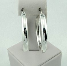 "Lovely vintage minimalist style sterling silver latch back circle hoop earrings. Marked 925. A great addition to your jewelry collection. FREE SHIPPING! Details: Sterling Silver: (as shown in photo) Approximate Earring Dimensions: (from open side) 1/2 inch across with a 5/8 inch gap at top x 1 5/8 inch tall x 3/16 inch wide. Total Weight (together): 8.0 grams FREE domestic shipping by USPS Priority Mail delivery confirmation and includes insurance. If the item is to be shipped internationally E Sterling Silver Minimalist Hoop Earrings With Shiny Finish, Everyday Sterling Silver Hoop Earrings With Shiny Finish, Minimalist Round Hoop Earrings With Shiny Finish, Modern Sterling Silver Round Hoop Earrings, Sterling Silver Hoop Earrings With Shiny Finish, Minimalist Hallmarked Round Hoop Earrings, Minimalist Hallmarked Hoop Earrings, Sterling Silver Huggie Earrings With Shiny Finish, Everyday White Gold Hoop Earrings With Sterling Silver Clasp