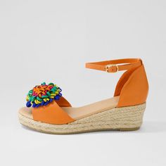 Step into summer with these FSJ Orange Wedge Floral Decor Ankle Strap Espadrille Sandals. The vibrant orange color and floral embellishments make them the perfect statement piece for your warm-weather wardrobe. Color: Orange Heel Type: Wedge heel Heel height: 2.1" / 53 mm approx Product measurements were taken using size 8. Please note that measurements may vary by size. Toe: Open toe Multicolor vegan suede floral embellishment Adjustable ankle strap Handcrafted US sizing. Fits true to size. Orange Platform Sandals With Ankle Strap, Orange Wedge Heel Sandals For The Beach, Orange Wedge Sandals For Summer, Orange Closed Toe Sandals For Summer, Casual Orange Platform Wedge Sandals, Casual Orange Closed Toe Wedge Sandals, Orange Platform Wedge Sandals For Beach, Orange Platform Wedge Sandals For Summer, Orange Round Toe Wedge Sandals For Vacation