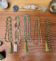 Handmade 108 Bead Gemstone Meditation Mala. Regular Malas are 33 Inches around with no clasp .  Malas are created with high quality gemstones . They have 108 beads for meditation and breath work practice.  August Birthstone Set - Peridot  A- Peridot , Aventurine , Snow Quartz and with a Silk Tassel. B-Peridot, Snow Quartz , Unakite with a Cambria Agate Pendant made my @Morro Bay Rock Co . C-Peridot, Rose Quartz , Turquoise and a Silk Tassel Pendant . D-Peridot , Picture Jasper and Metal Moth Pen Spiritual Style Faceted Round Beaded Necklaces, Spiritual Style Round Faceted Beads Necklace, Spiritual Beaded Necklace With Faceted Oval Beads, Spiritual Beaded Necklaces With Faceted Oval Beads, Healing Beaded Necklaces With Round Natural Stones, Healing Beaded Necklaces With Natural Stones And Round Beads, Spiritual Faceted Beads Jewelry For Meditation, Bohemian Green Crystal Necklaces With Gemstone Beads, Bohemian Crystal Necklaces With Faceted Beads For Healing