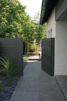 an entrance to a house with stone walkway