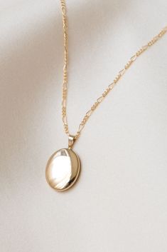 The perfect locket to hold what's most special to you! Our Oval Locket Necklace is simple enough to wear everyday and looks great layered! Gold filled or sterling silver - perfect for everyday wear without tarnishing. AND they’re affordable. Find more at Simple & Dainty! Dainty Oval Pendant Locket Necklace For Anniversary, Dainty Oval Locket Necklace For Anniversary, Classic Oval Necklace For Memorial, Dainty Locket Necklace For Memorial, Dainty Locket Necklace For Memorials, Oval Locket Necklaces For Mother's Day, Oval Locket Jewelry For Everyday, Oval Locket Necklace For Memorials, Dainty Everyday Locket Necklace