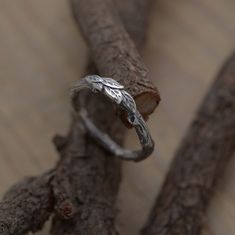 Unique artistic ring with leaves in sterling silver. Tree branch ring 2.5mm wide. Nature inspired engagement ring. Friendship and nature lover artistic gift. Bohemian chic sterling silver jewellery. A twig oxidized sterling silver ring for women who enjoy the outdoors and nature. What makes this handmade 2.5width ring so special is the texture and style of the oxidized sterling silver that resembles a small tree branch with various leaves, symbols of love for nature. It also makes a handsome gif Silver Nature-inspired Stackable Rings For Anniversary, Nature-inspired Silver Stackable Rings For Anniversary, Ring With Leaves, Tree Branch Ring, Branch Engagement Ring, Twig Engagement Ring, Beautiful Wedding Bands, Nature Inspired Engagement Ring, Twig Ring