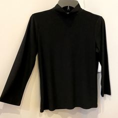 Brand New W/Tag 96% Polyester Turtle Neck Black Mock Neck Top For Fall Layering, Winter High Neck Black Tops, Black Mock Neck Top For Winter Layering, Fitted Black Mock Neck Top For Winter, Classic Black High Neck Top, Black High Neck Classic Top, Classic High Neck Black Top, Spring Mock Neck Top For Workwear, Fall Fitted Black Mock Neck Top