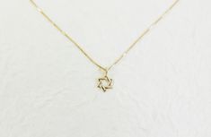 Tiny 14k solid gold star of david necklace. Judaica Jewelry. david star necklace. magen david necklace. kabala necklace. Jewish jewelry This supper tiny Magen David (star of David) is perfect for women or a women who want dainty and tiny pendant. Necklace info : 14kt real solid gold . it can be in yellow or white gold ( select it on the checkout page). The charm wide is 6.6mm High: 10.5 (include hoop) Pendant thickness: 0.67mm. The necklace packaged and shipped in a beautiful gift box. It takes Silver Star Of David Necklace In 14k Gold, Gold Sterling Silver Star Of David Necklace, Sterling Silver Star Of David Fine Jewelry Necklace, 14k Gold Silver Star Of David Necklace, Elegant 14k Gold Star Of David Jewelry, Silver Star Of David Pendant In 14k Gold, Gold Star Of David Necklace In 14k Gold, Silver Star Of David Jewelry In 14k Gold, Silver Star Of David 14k Gold Jewelry