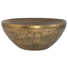 a large metal bowl sitting on top of a table