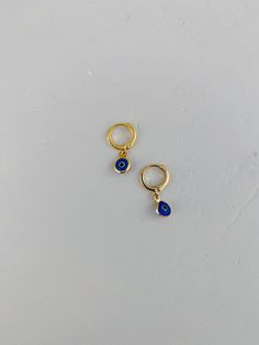 Positive vibes✨ Gorgeous dark blue evil eye wrapped in gold, paired with a match gold huggie earring! Such adorable earrings that will elevate any outfit! Evil eyes are approximately 10x6.5mm in size. Flat style charm, 18k gold plated. Blue Small Hoop Huggie Earrings, Blue Hypoallergenic Small Hoop Huggie Earrings, Hypoallergenic Blue Small Hoop Huggie Earrings, Adjustable Gold Evil Eye Earrings, Blue Huggie Hoop Earrings For Pierced Ears, Handmade Blue Huggie Earrings, Blue Teardrop Hypoallergenic Hoop Earrings, Blue Hypoallergenic Teardrop Hoop Earrings, Everyday Blue Teardrop Hoop Earrings