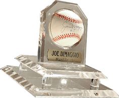 an award with a baseball inside of it on top of a plastic base that says joe dimagoio