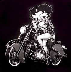 a black and white photo of a woman on a motorcycle with flowers in her hair