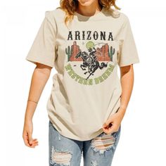 Opt for this Vintage Rodeo Printed T-Shirt for Women! 













 This vintage women's t-shirt is a true mix of boho , hipster and 70s cowboy styles. With its rodeo print of a horse and a cowboy, it evokes the essence of the American West. Retro details and bright colors add an authentic touch, while the flattering cut and short sleeves provide optimal comfort. Whether you want to adopt a boho, retro or cowboy look, this t-shirt will be a perfect choice to express your unique style with elegance and originality.

 ✂ DETAILS



 Very soft (anti-friction)

 Anti-odor (breathable fibers)

 Durable and resistant print

 Composition: premium cotton

 Washing: machine washable at 30 degrees





 ✂ SIZE GUIDE 












 Size 

 Bust 

 Shoulder


  Length 






 S 

 92 

 41 

 66 Bohemian Graphic Print Rodeo Top, Bohemian Graphic Print Tops For Rodeo, Vintage Summer T-shirt For Rodeo, Casual T-shirt For Western-themed Fall Events, Retro Summer Rodeo T-shirt, Retro Summer T-shirt For Rodeo, Crew Neck T-shirt For Western-themed Spring Events, Retro Fall Rodeo T-shirt, Retro T-shirt For Western-themed Summer Events