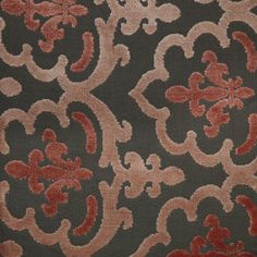 a brown and red pattern on fabric