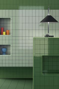 a green tiled room with shelves and a lamp