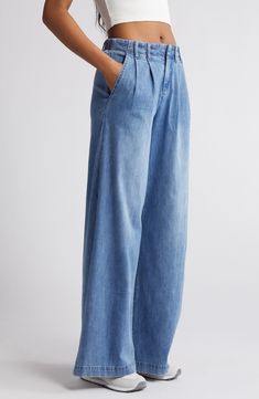 Make a statement in these pleated, vintage-inspired jeans fashioned with trouser-style pockets and superwide legs that sway with every step. 32" inseam; 30" leg opening; 11 1/2" front rise; 15 1/2" back rise Zip fly with button closure Side slant pockets 63% cotton, 27% polyester, 8% rayon, 2% spandex Machine wash, tumble dry Imported Spring Wide Leg Flare Jeans For Elevated Casual, Light Wash Wide Leg Flare Jeans For Work, Wide Leg Light Wash Flare Jeans For Work, Denim Wide Leg Pants For Work, Wide Leg Relaxed Fit Flare Jeans With Pockets, High Rise Cotton Wide Leg Pants For Elevated Casual, Elevated Casual Wide Leg Denim Flare Jeans, Wide Leg Washed Blue Jeans For Work, Denim Blue Wide Leg Pants With Pockets