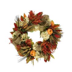 a wreath with white flowers and oranges on it