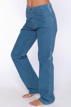 "Vintage 70s jeans in blue denim with a high waist. Unisex and probably originally for men. Every item we sell is authentic vintage and one-of-a-kind! You will receive the EXACT item shown in the photos. For reference, model is 5'8\" and measures 33-23-35. DETAILS Best fits: Labelled 30 x 34 but measures 29 in the waist. Fits a tall women's Extra small to Small. (Note: We only have ONE in stock. If more than one size is listed it is because this item will work on a range of sizes. Check measurem 70 Jeans, Bohemian Jeans, 70s Jeans, Lace Babydoll Dress, 70s Denim, Boho Jeans, Vintage Hipster, Boho Blue, Jean Vintage