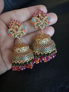 It's elegant and classic...the matching earrings perfect match for style statement.... This beautiful and traditional naratan jarao jhumka earrings in multi stones and gold plating made for someone special like you.. Grab it before anyone else! Color: multi  Back In stock and ready to ship. Note :Color, shades, texture displayed may slightly vary from the actual product due to digital image limitations. We request you to consider these minor variations. Please expect the possibility of some slig Earrings Jhumka, Pakistani Earrings, Gold Jhumka, Jewelry Pakistani, Fancy Jewellery Designs, Pakistani Jewelry, Indian Earrings, Jewelry Indian, Fancy Jewellery