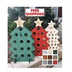 three wooden christmas trees with holes in them and the words free shipping on each side