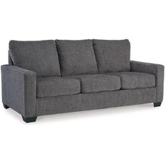 a gray couch sitting on top of a white floor