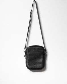 This timeless men’s crossbody bag maintains a classic shape that never goes out of style. Designed with a long strap, it can be worn comfortably as a shoulder or crossbody bag, perfect for when you’re on the move. The bag boasts a discreet and minimalist design, made from durable genuine leather, featuring a reliable YKK metal zipper from Japan, waterproof lining, and premium metal hardware. Size: 8.3 x 6.3 x 1.6 inches. Classic Bag With Cell Phone Pocket For Everyday Carry, Crossbody Mobile Phone Bag For Everyday Carry, Business Crossbody Camera Bag With Phone Pocket, Everyday Carry Mobile Phone Crossbody Bag, Classic Shoulder Bag With Zipper Pocket For Everyday, Business Camera Crossbody Bag With Mobile Phone Slot, Classic Crossbody Travel Pouch, Classic Everyday Carry Mobile Phone Bag, Classic Everyday Mobile Phone Bag