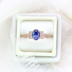 "This unique natural Sapphire has a beautiful saturated Cornflower Blue color. Set in a double prong setting with a decorative halo of milgrain around the stone. Accented with marquise natural white diamonds. The sapphire comes with a gemstone certificate. Ring Size 6 - Ready to ship Please contact me if you wish to have this ring re-sized ------------------------------------------------------------------------------ ♦ITEM DETAILS: * 1.16ct | 6.71x4.99 | Oval Cornflower Blue Sapphire * Comfort-f Elegant Tanzanite Wedding Ring With Prong Setting, Heirloom Sapphire Ring With Halo Design For Wedding, Oval Tanzanite Wedding Ring, Wedding Halo Ring With Tanzanite In Halo Setting, Elegant Tanzanite Sapphire Ring With Halo, Heirloom Sapphire Halo Ring For Weddings, Tanzanite Halo Ring For Wedding, Rose Gold Sapphire Wedding Rings With Accent Stones, Elegant Tanzanite Promise Ring