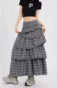 Channel understated chic with this Layered Plaid Maxi Skirt featuring delicate ruffle details.
Crafted from a comfortable blend of mainly cotton, this skirt showcases a multi-layered design that adds a playful twist to the classic plaid pattern. The high-waist cut ensures a flattering silhouette, while the versatile style makes it easy to dress up or down. It's a piece that carries a perfect balance of edgy and professional aesthetics.
Pair this skirt with a tucked-in graphic tee and sneakers fo Skirt Layering Outfit, Checked Skirt Outfit, Heels For Office, Pattern Maxi Skirt, Layered Maxi Skirt, Plaid Maxi Skirt, Casual Maxi Skirt, Long Plaid Skirt, Layered Ruffle Skirt