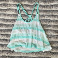 Light Blue And White Stripe Crop Top Size: Xs Brand: Hollister Colors: Light Blue, Mint Blue And White Condition: New With Tag Great Spring And Summer Shirt Comes From A Smoke And Pet Free Home Light Blue Tank Top For Beach In Spring, Light Blue Summer Tank Top For The Beach, Summer Striped Tops For Beach, Summer Striped Tops For The Beach, Striped Summer Tops For The Beach, Sleeveless Striped Tops For Beach Season, Light Blue Summer Tank Top For Vacation, Summer Light Blue Tank Top For Vacation, Light Blue Cotton Tank Top For The Beach