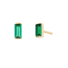 Introducing our charming tiny baguette cut emerald stud gold earrings – the perfect touch of elegance for any ensemble. These exquisite studs feature dazzling emerald gemstones in a classic baguette cut, set in a sleek gold bezel. These petite earrings are designed to catch the light and make a subtle statement, showcasing the captivating green hue of the emeralds.  Made of 14K gold plated sterling silver with emerald gemstones.   Butterfly backs.  Hypoallergenic, nickel and lead-free; Tarnish resistant. H2O sensitive. Before showering or working out, remove your plated jewelry. Clean your piece by buffing gently with a dry cloth and storing it in your pouch. Earing Designs Gold, Stud Gold Earrings, Emerald Stud Earrings, Petite Earrings, Emerald Earrings Studs, September Birthstone Jewelry, August Birthstone Jewelry, July Birthstone Jewelry, Jewelry Ring Box