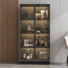 an empty chair sits in front of a tall glass cabinet with liquor bottles on it