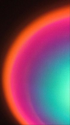 an image of a multicolored circle on a black background that appears to be blurry