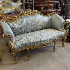 an ornately decorated couch in a store