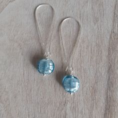 Beautiful Aqua Blue Silver Foil Glass Bead Sterling Silver Drop Earrings Perfect wear and gift for any occasions :)  Ear wire types: Small - 1.5 cm Medium - 3.3 cm Large - 5 cm Aqua Blue Silver Foil Glass Beads are flat coin beads and 12 mm in size You may find matching items in the shop. Made with love in a smoke and pet free home. Thank you for your interest in my items :) Bead Drop Earrings, Sterling Silver Drop Earrings, Beaded Drop Earrings, Silver Drop Earrings, Silver Foil, Earrings Sterling Silver, Sterling Earrings, Glass Bead, Aqua Blue