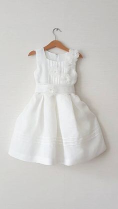 "This dress has pleated top design decorated with 5 big flowers and wide belt with a large beautiful bow on the back.  This elegant ball gown makes your girl more fashionable, attractive, beautiful.  Fabric softened linen 100% Full lined cotton 100% Sleeveless  With belt Children size chart Size: 68-74cm, 27-29 inch, Age 6-9 months Waist 17.3 inch, 44cm Size: 74-80cm, 29-31.5 inch., Age 9-12 months Waist 18.1 inch, 46cm  Size: 80-86cm, 31.5-33.8 inch., Age 12-18 months Waist 19.0 inch, 48cm  Size: 86-92 cm, 33.8-36.2 inch, Age 18-24 months Waist 19.3 inch, 49cm Age 2Y, US Size 24m, EU Size 92 Bust/Waist/Hips 55cm/52,5 cm/ 56cm 21,6\"/ 20,6\"/ 22\" Age 3Y, US Size 2T, EU Size 98 Bust/Waist/Hips 56cm/53,5 cm/ 58 cm 22\"/ 21.0\"/ 22,8\" Age 4Y, US Size 4T, EU Size 104 Bust/Waist/Hips 57cm/54, White A-line Princess Dress For Wedding, Elegant Spring Princess Dress With Fitted Bodice, Elegant Summer Bridesmaid Princess Dress, Spring Princess Dress With Fitted Bodice For Bridesmaid, Elegant Spring Princess Dress For Baptism, Fitted Princess Dress For Summer Wedding, Elegant White Princess Dress With Fitted Bodice, Summer Wedding Fitted Princess Dress, Summer Bridesmaid Princess Dress With Ruffles