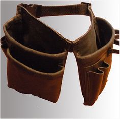 an old pair of brown leather gaiters with straps on the bottom and inside