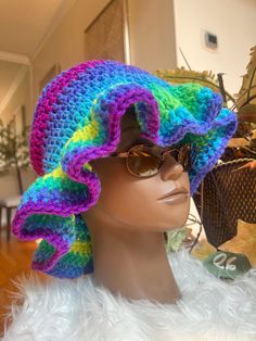 Stay stylish and on-trend with this handmade crochet ruffle hat. Made with soft and durable yarn, this hat is perfect for adding a touch of boho-chic to any outfit. The classic ruffle/bucket hat style is updated with a unique crochet design, making it a versatile and fashionable accessory for any season. Whether you're out for a day of shopping or heading to the beach, this hat is sure to keep you looking cool and feeling comfortable. Treat yourself or a loved one to this must-have accessory and add a touch of handmade charm to your wardrobe. Handcrafted with care and attention to detail, this crochet ruffle/bucket hat is a true statement piece that you'll love to wear again and again. Thank you for supporting my business and choosing handmade! CARE: Hand wash in cold water with detergent. Bohemian Beanie Crochet Hat, Bohemian Winter Crochet Bucket Hat, Bohemian One-size Crochet Hat, Bohemian Yarn Hat Adjustable Size, Bohemian Cotton Yarn Hats For Winter, Bohemian Crochet Hat For Spring, Bohemian Crochet Bucket Hat For Winter, Bohemian Yarn Hat, Hippie Crochet Hat For Beach, One Size