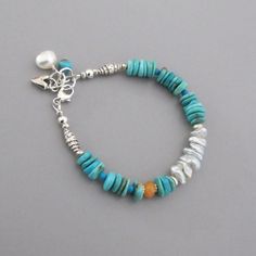 "Beautiful polished American Turquoise, pale icy blue Keishi Pearls, and a solitary Carnelian mingle with handmade silver beads. It closes with a lobster claw clasp and has an extender chain. A Turquoise nugget, a white freshwater pearl and a little handmade silver heart charm drop from the end of the chain. All metal is solid .925-.970 sterling and fine silver. This bracelet is made to order and will vary slightly from the photos. Turquoise - approx. 8, 5 and 3mm Carnelian - approx. 6.5mm Pearl Bohemian Light Blue Bracelets For Jewelry Making, Adjustable Light Blue Bohemian Bracelets, Bohemian Light Blue Bracelet, Southwestern Blue Beaded Bracelets With Natural Stones, Turquoise Gemstone Beaded Bracelets In Bohemian Style, Southwestern Style Blue Beaded Bracelets With Natural Stones, Bohemian Turquoise Gemstone Beaded Bracelets, Rustic Turquoise Bracelet Jewelry, Rustic Blue Adjustable Beaded Bracelets