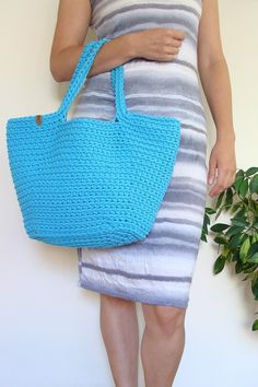 Boho chic, this crochet bag is irreplaceable during summer. This classic basket shape purse is ideal addition to flimsy dress or to short or long jeans, t-shirt and sweater. Either as a summer accessory, as a beach bag or everyday bag - it's comfortable in using. Roomy enough to fill it with books, beach stuff, kid's stuff or groceries. Perfect as a gift too! Trendy Spring Basket Crochet Bag, Rectangular Cotton Straw Bag For Summer, Casual Crochet Straw Bag For Summer, Cotton Beach Bag For Summer, Eco-friendly Cotton Straw Bag For Beach, Casual Handwoven Cotton Straw Bag, Spring Vacation Cotton Straw Bag, Casual Cotton Handwoven Straw Bag, Trendy Crochet Straw Bag For The Beach