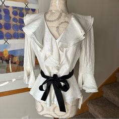 Brand: Adriana Papell Size: 6 New With Tags $110 Perfect For The Holidays Or Specials Occasion. Pair With A Skirt Or Black Pants Or A Pair Of Jeans And Some Black Heels. Color: White With A Subtle Shimmer. Black Ribbon Accent Belt. Pit To Pit: 16.5” Length: 22.5” Sleeve: 18” Any Questions, Just Ask! Elegant Spring Blouse For Brunch, Elegant Blouse For Spring Brunch, Elegant White Blouse For Day Out, Feminine Fitted Blouse For Brunch, Fitted Feminine Blouse For Brunch, Elegant Fitted Blouse For Day Out, Chic Fitted Blouse For Day Out, Elegant White Blouse For Brunch, Elegant Fitted Tops For Brunch