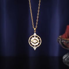 Let protection from the universe come to your neck with this Cosmic Evil Eye Necklace! Featuring an eye-catching design and made of high-quality materials, this masterpiece will have your aura shield-on in no time! Unstoppable style meets all-seeing security--your bohemian glory awaits! DETAILS Plating: 18K Gold Materials: 18K Gold on Brass,  Mother of Pearl , Zircon Measurements: Length:   15.55"(39.5cm)  + Extender: 1.97"(5cm) Pendant Size: 1.77"* 0.98 "(4.5cm*2.5cm) Weight:  9.4 g Spiritual Gold Eye-shaped Necklace, Mystical Gold Pendant Necklace, Spiritual Metal Evil Eye Necklace, Spiritual Evil Eye Metal Necklace, Astrology Jewelry, Blue Morpho Butterfly, Blue Morpho, Butterfly Gifts, Purple Grapes