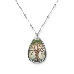 **Product description: Tree of Life Necklace** - **Material Zinc alloy for pendants and chains - **Pendant shape Elliptical - **Surface White aluminum printing surface This elegant tree of life necklace symbolizes growth, strength and connection. The elliptical pendant is made of a robust zinc alloy and offers long-lasting quality. The white aluminum print surface on the pendant beautifully highlights the detailed tree of life motif. With the matching zinc alloy chain, this necklace is a stylish Silver Tree Of Life Round Pendant Necklace, Spiritual Nickel-free Teardrop Necklace, Symbolic Silver Necklace With Tree Of Life, Tree Of Life Pendant Necklace As Gift, Spiritual Nickel-free Teardrop Pendant Necklace, Unique Tree Of Life Pendant Necklace, Nature-inspired Tree Of Life Pendant Necklace, Nature-inspired Silver Necklace For Meditation, Nature-inspired Silver Meditation Necklace