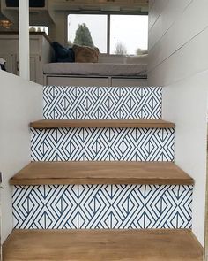 some stairs with blue and white tiles on them